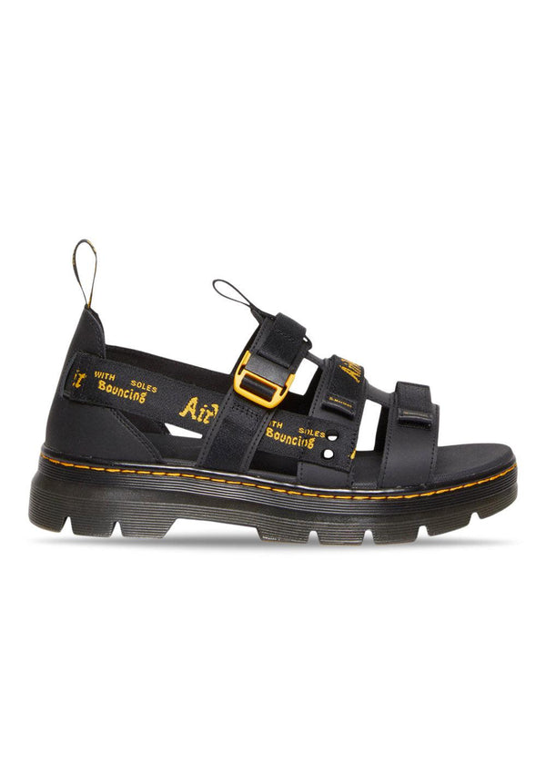 Dr. Martens' Pearson - Black Luster Coated Leather+Webbing. Buy sandals here.