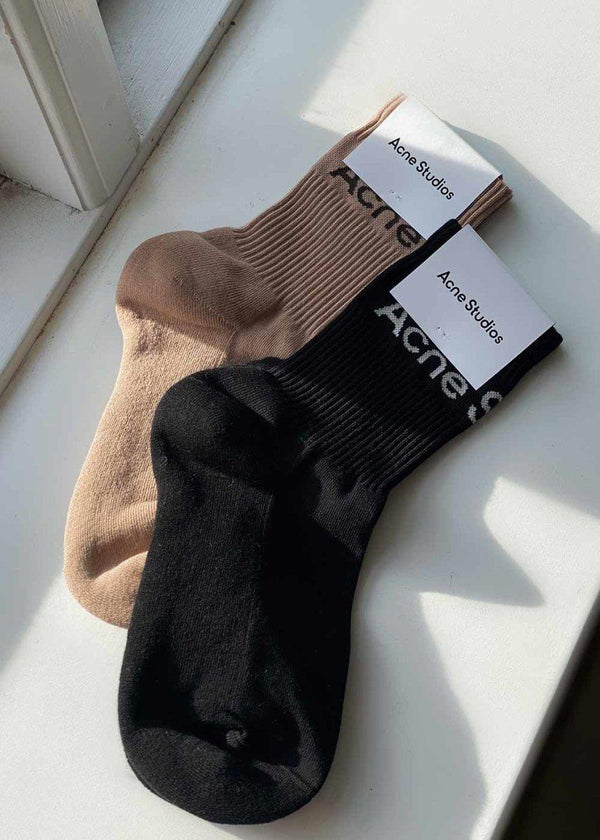 Acne Studios' FN-UX-ACCS000078 - Black/Ivory. Buy socks/stockings here.